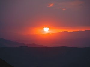 Preview wallpaper sunset, slope, sun, hills, sky