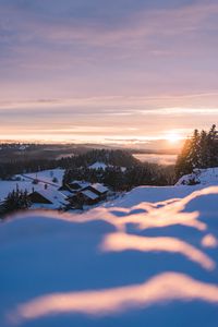 Preview wallpaper sunset, snow, houses, mountains, winter, landscape