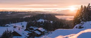Preview wallpaper sunset, snow, houses, mountains, winter, landscape