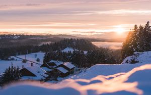 Preview wallpaper sunset, snow, houses, mountains, winter, landscape