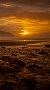 Preview wallpaper sunset, stone, water, waves