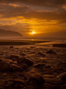 Preview wallpaper sunset, stone, water, waves