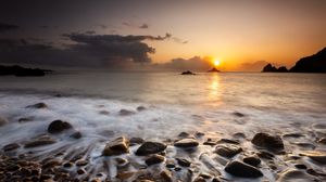 Preview wallpaper sunset, stones, pebbles, sea, horizon