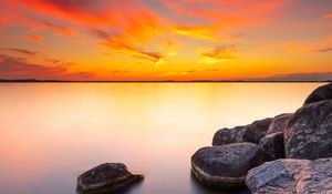 Preview wallpaper sunset, stones, rocks, horizon, sea
