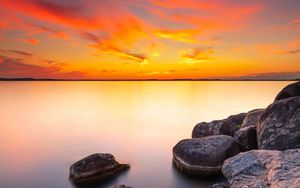 Preview wallpaper sunset, stones, rocks, horizon, sea