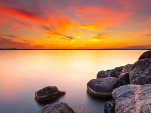 Preview wallpaper sunset, stones, rocks, horizon, sea