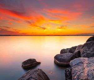 Preview wallpaper sunset, stones, rocks, horizon, sea