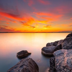 Preview wallpaper sunset, stones, rocks, horizon, sea