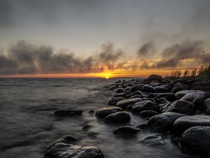Preview wallpaper sunset, stones, sea, water, horizon, sky