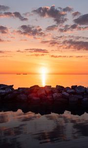 Preview wallpaper sunset, stones, sea, horizon, sky