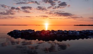 Preview wallpaper sunset, stones, sea, horizon, sky