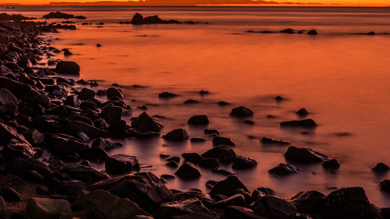 Wallpaper sunset, stones, water, horizon