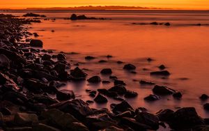 Preview wallpaper sunset, stones, water, horizon