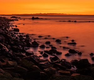 Preview wallpaper sunset, stones, water, horizon