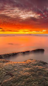 Preview wallpaper sunset, stones, water, horizon, sky