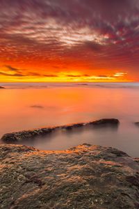 Preview wallpaper sunset, stones, water, horizon, sky