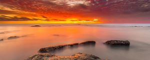 Preview wallpaper sunset, stones, water, horizon, sky