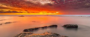 Preview wallpaper sunset, stones, water, horizon, sky