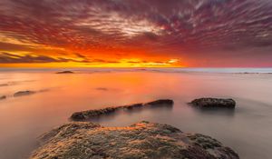 Preview wallpaper sunset, stones, water, horizon, sky
