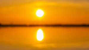 Preview wallpaper sunset, sun, beach, sand, water, reflection