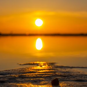 Preview wallpaper sunset, sun, beach, sand, water, reflection