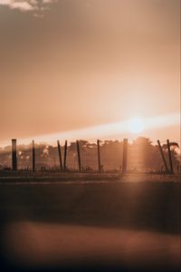 Preview wallpaper sunset, sun, bright, fence, dusk