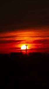 Preview wallpaper sunset, sun, buildings, city, sky