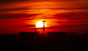 Preview wallpaper sunset, sun, buildings, city, sky