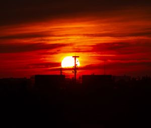Preview wallpaper sunset, sun, buildings, city, sky