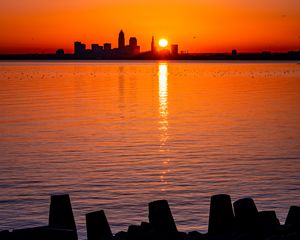 Preview wallpaper sunset, sun, city, silhouettes, water, dark