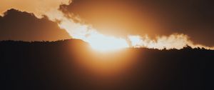 Preview wallpaper sunset, sun, clouds, light, dusk