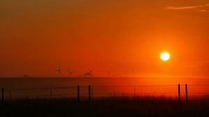 Preview wallpaper sunset, sun, dusk, field, landscape