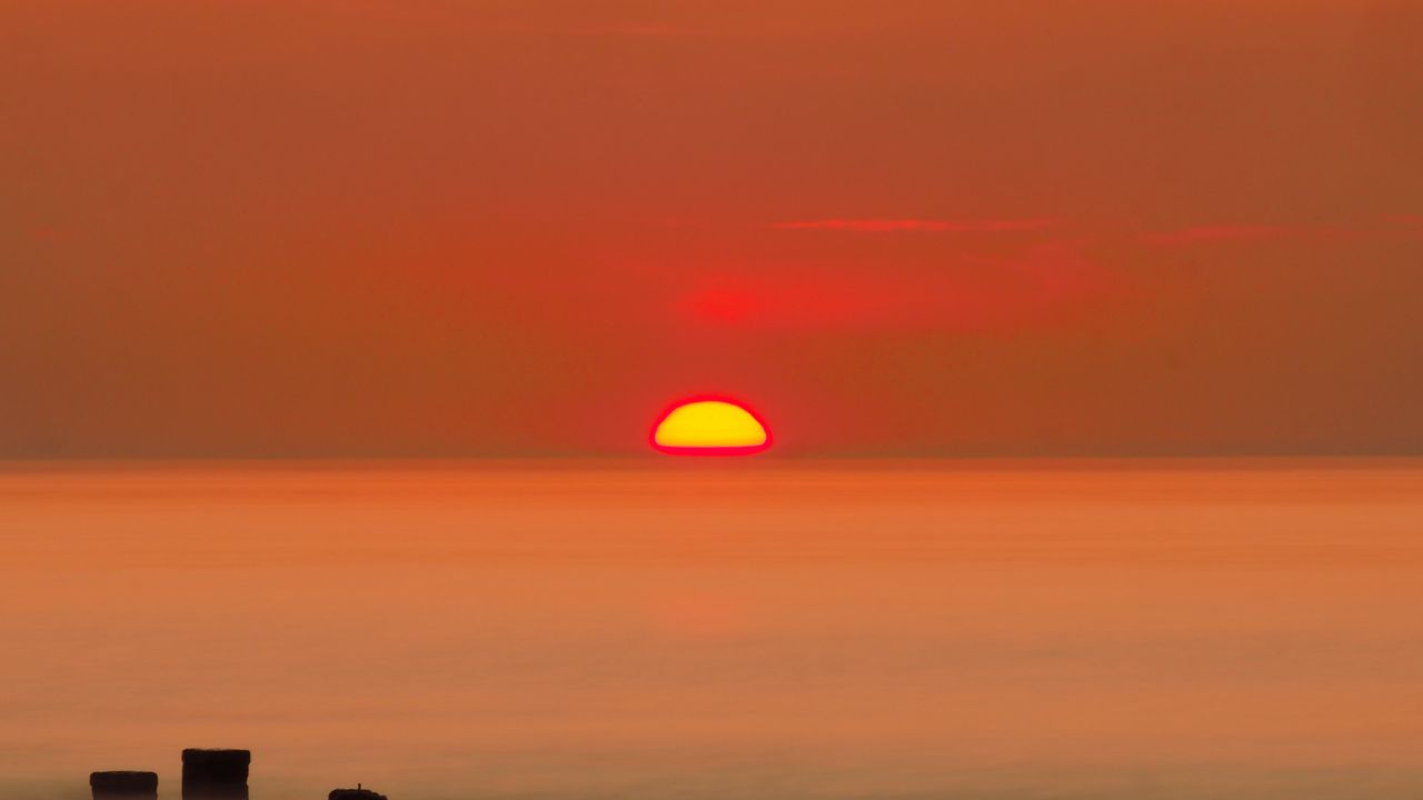 Wallpaper sunset, sun, fog, sea, horizon