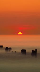Preview wallpaper sunset, sun, fog, sea, horizon