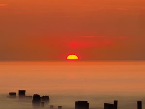 Preview wallpaper sunset, sun, fog, sea, horizon