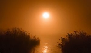 Preview wallpaper sunset, sun, glare, grass, lake