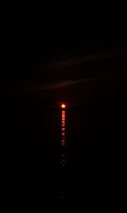 Preview wallpaper sunset, sun, glare, water, dark, horizon