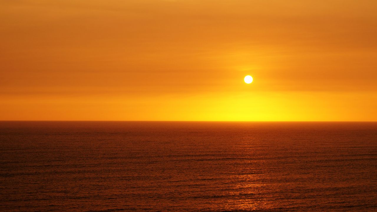 Wallpaper sunset, sun, glare, water, waves