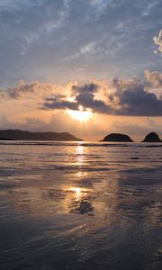 Preview wallpaper sunset, sun, glare, sea, clouds