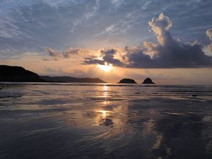 Preview wallpaper sunset, sun, glare, sea, clouds