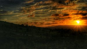 Preview wallpaper sunset, sun, hills, landscape, trees, nature
