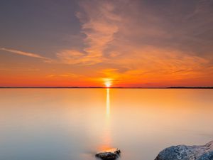 Preview wallpaper sunset, sun, horizon, stones, sky