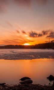 Preview wallpaper sunset, sun, lake, ice, stones