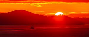 Preview wallpaper sunset, sun, mountains, sea, nature, red