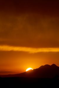 Preview wallpaper sunset, sun, mountains, silhouettes, dark