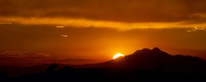 Preview wallpaper sunset, sun, mountains, silhouettes, dark