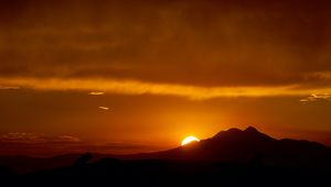 Preview wallpaper sunset, sun, mountains, silhouettes, dark