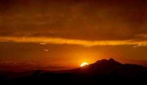 Preview wallpaper sunset, sun, mountains, silhouettes, dark