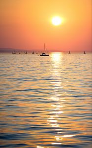 Preview wallpaper sunset, sun, ocean, boats, horizon