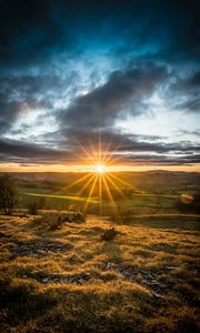 Preview wallpaper sunset, sun, rays, light, field, landscape